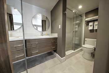 Poolside Queen | Bathroom | Shower, designer toiletries, towels, soap at Oasis at Gold Spike