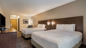A hotel room with two beds, a desk, a television, and a framed picture on the wall. - Best Western Mt. Hood Inn (Government Camp)