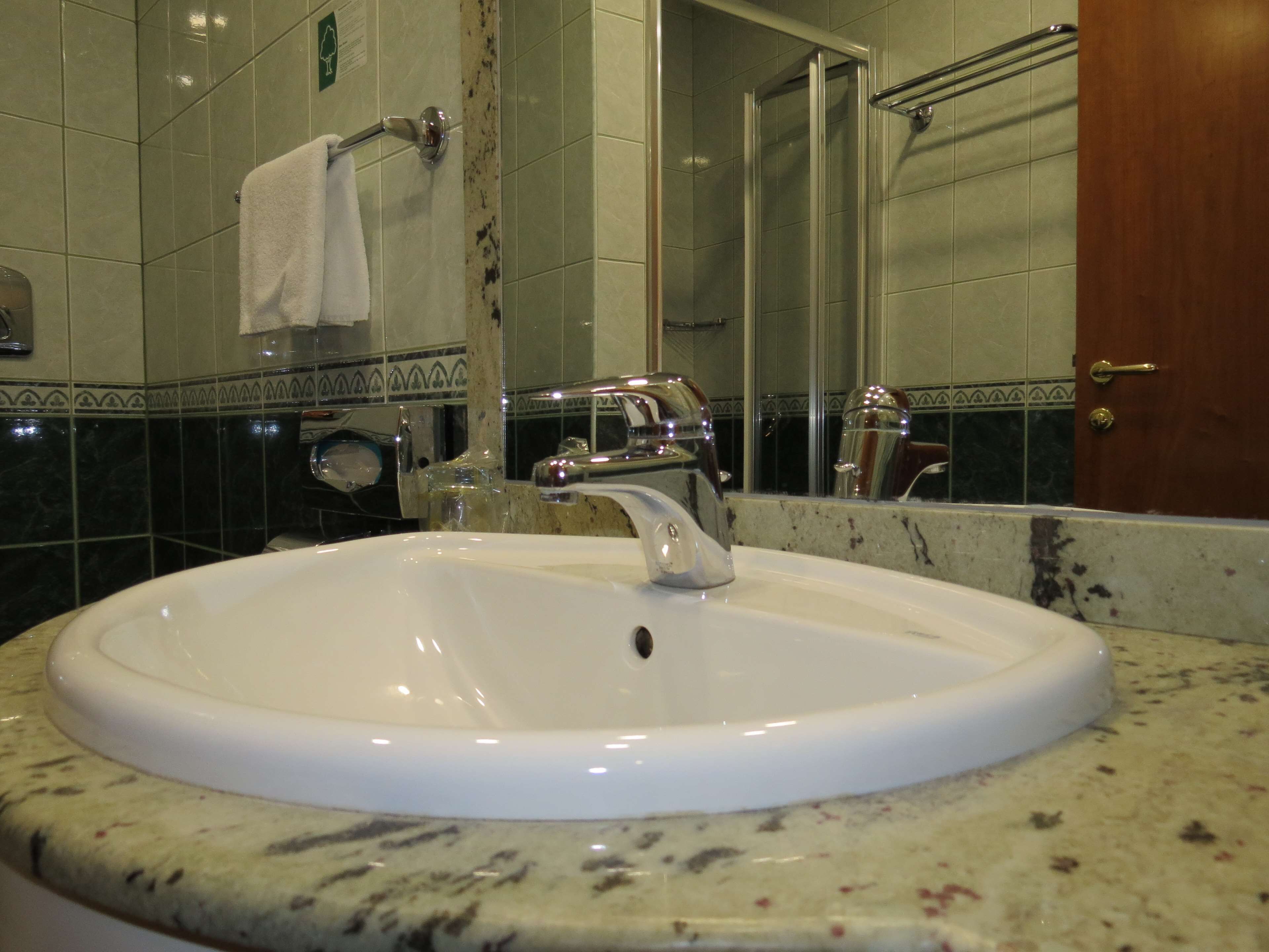 eco-friendly toiletries, hair dryer, towels, soap