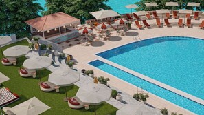 Zona junto a la piscina con sillones reclinables, sombrillas y un área de estar cubierta.