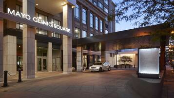 A modern building with a sign reading "Mayo Clinic Square."