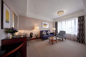 Deluxe Suite with Lounge Access | In-room safe, desk, blackout drapes, soundproofing