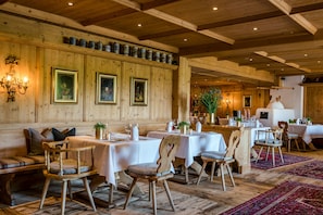 Breakfast, dinner served; international cuisine, golf course views