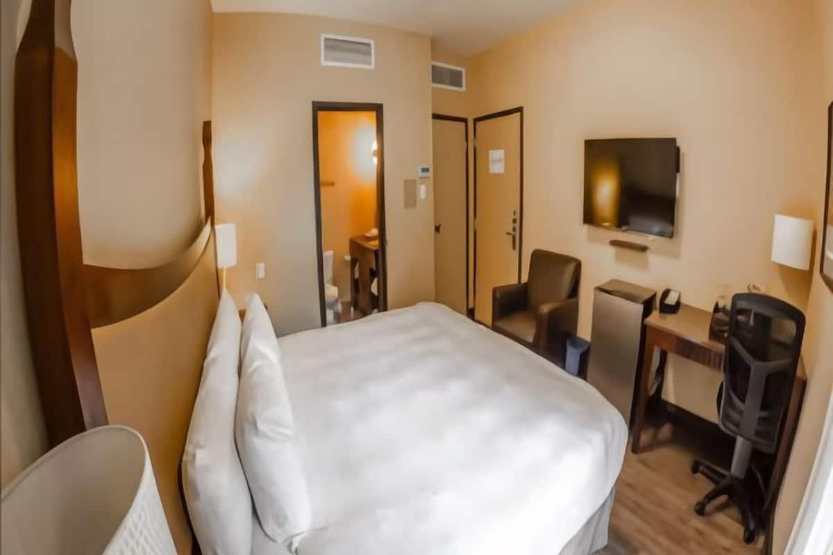 Premium bedding, blackout drapes, iron/ironing board, free WiFi