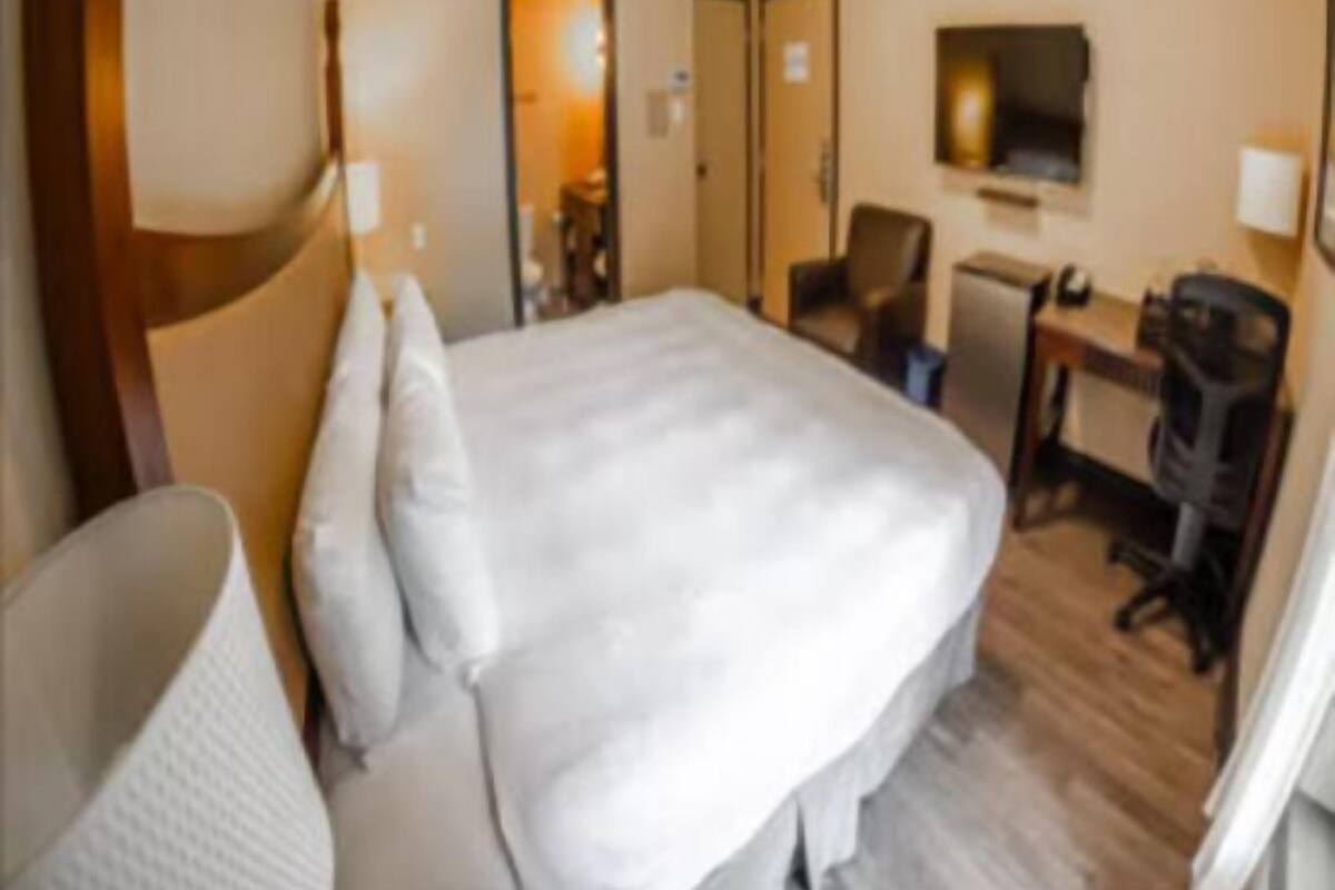 Premium bedding, blackout drapes, iron/ironing board, free WiFi