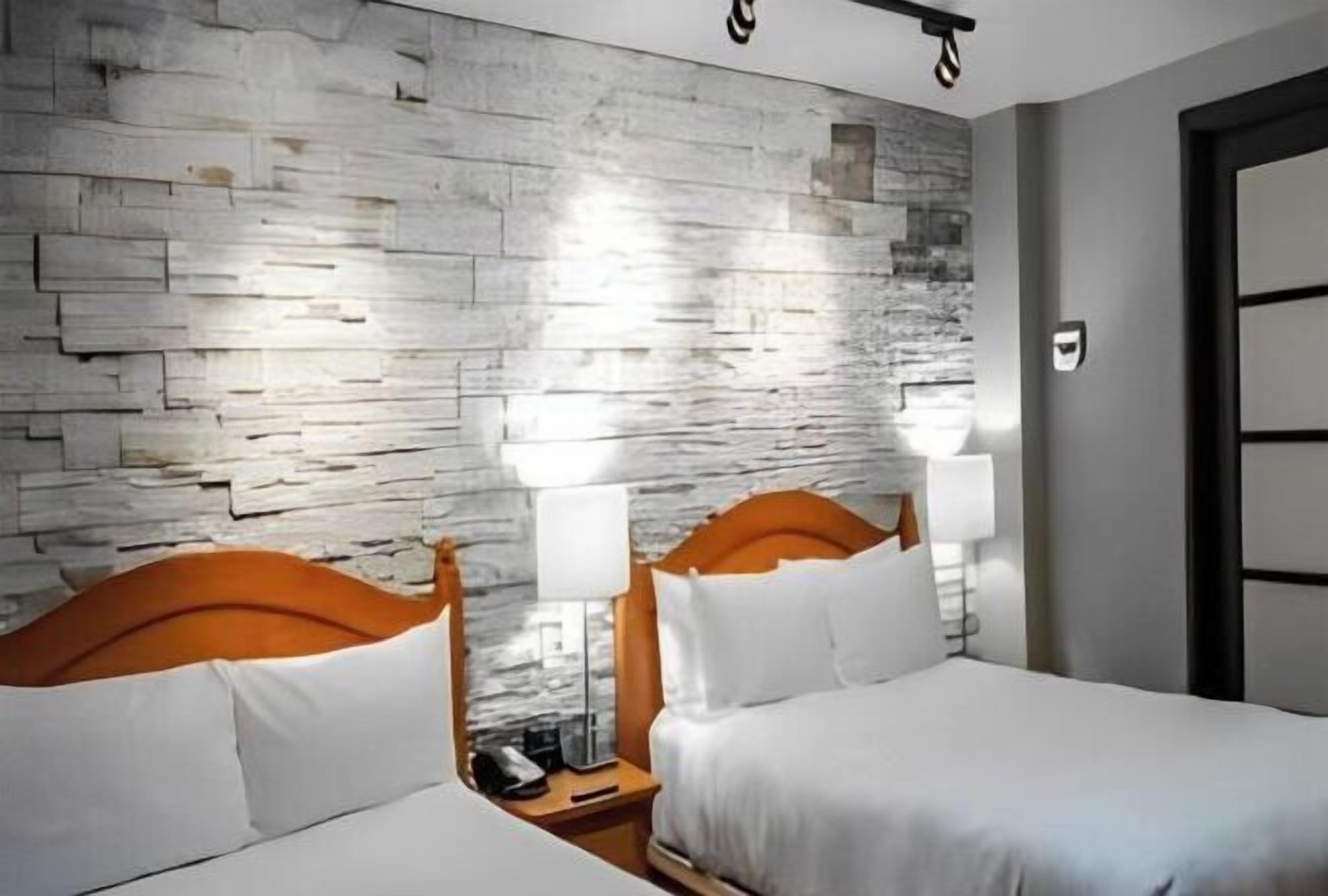 Premium bedding, blackout curtains, iron/ironing board, free WiFi