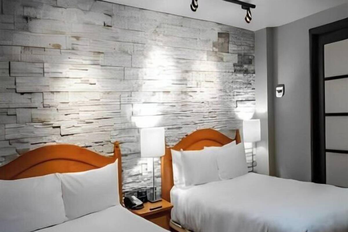 Premium bedding, blackout drapes, iron/ironing board, free WiFi