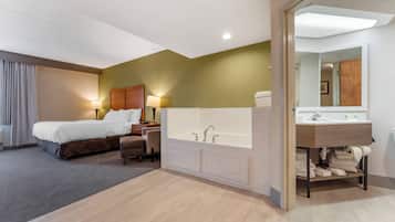 Chambre Deluxe, 1 très grand lit, non-fumeurs, bain à remous | Coffres-forts dans les chambres, bureau, chambres insonorisées