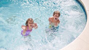 Guests can enjoy a refreshing swim in the pool surrounded by a spacious deck.