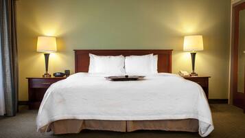 Hypo-allergenic bedding, desk, laptop workspace, blackout drapes