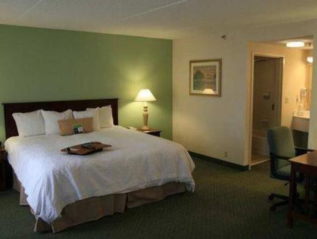 Hypo-allergenic bedding, desk, laptop workspace, blackout curtains