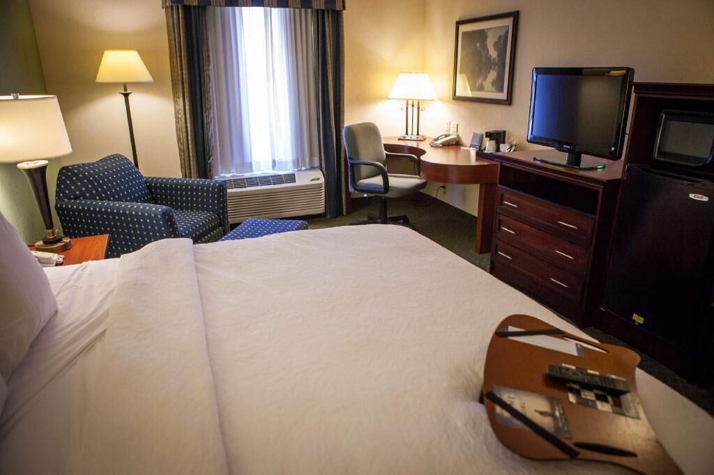 Hypo-allergenic bedding, desk, laptop workspace, blackout curtains