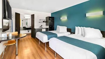 Suite estándar, 2 camas Queen size, para no fumadores | Escritorio, wifi gratis y ropa de cama