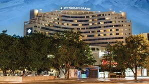 A hotel with a modern design, featuring multiple floors and a prominent sign reading "Wyndham Grand". - Wyndham Grand Kayseri (Kocasinan)