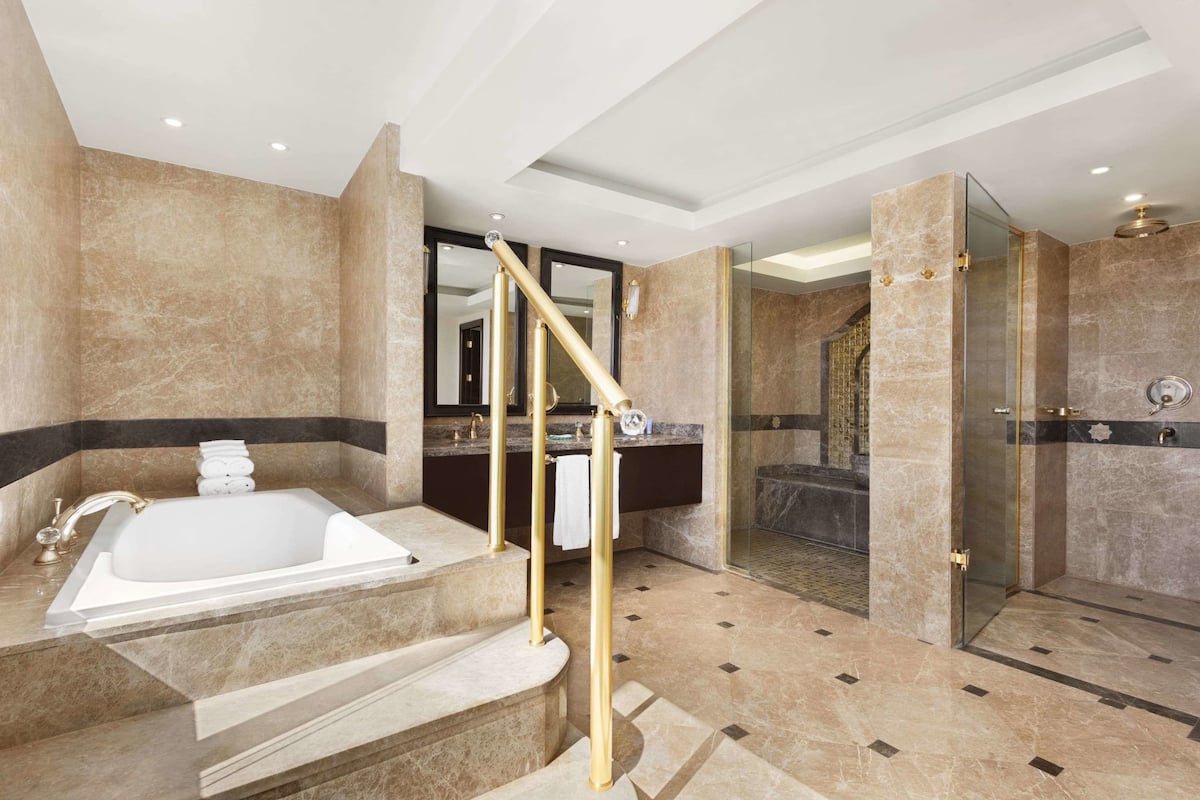 presidential suite, 1 king bed, smoking | bathroom | deep-soaking bathtub, rainfall showerhead, hair dryer, bathrobes