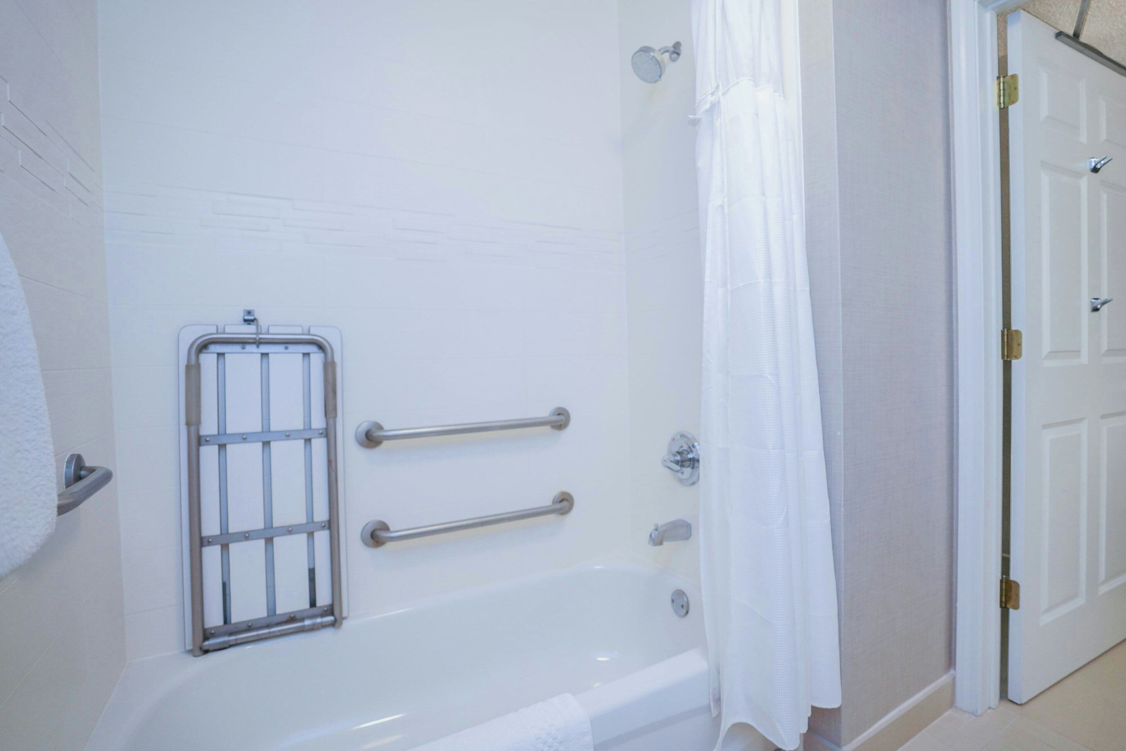 designer toiletries, hair dryer, towels, soap