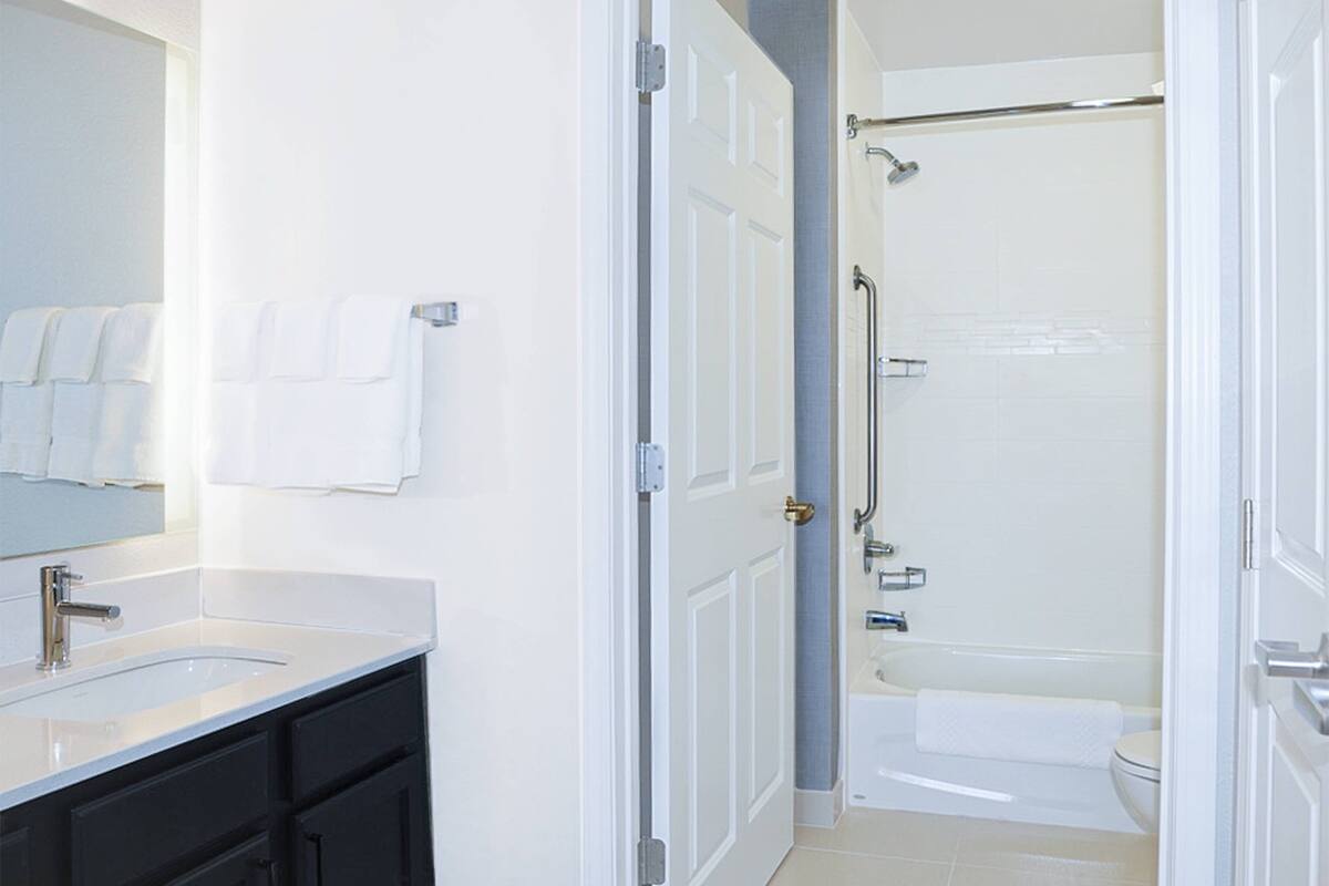 designer toiletries, hair dryer, towels, soap