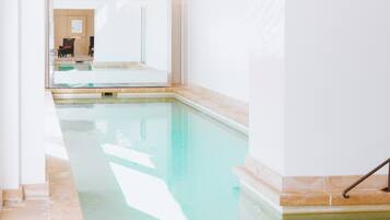 Indoor pool, seasonal outdoor pool, pool umbrellas, pool loungers