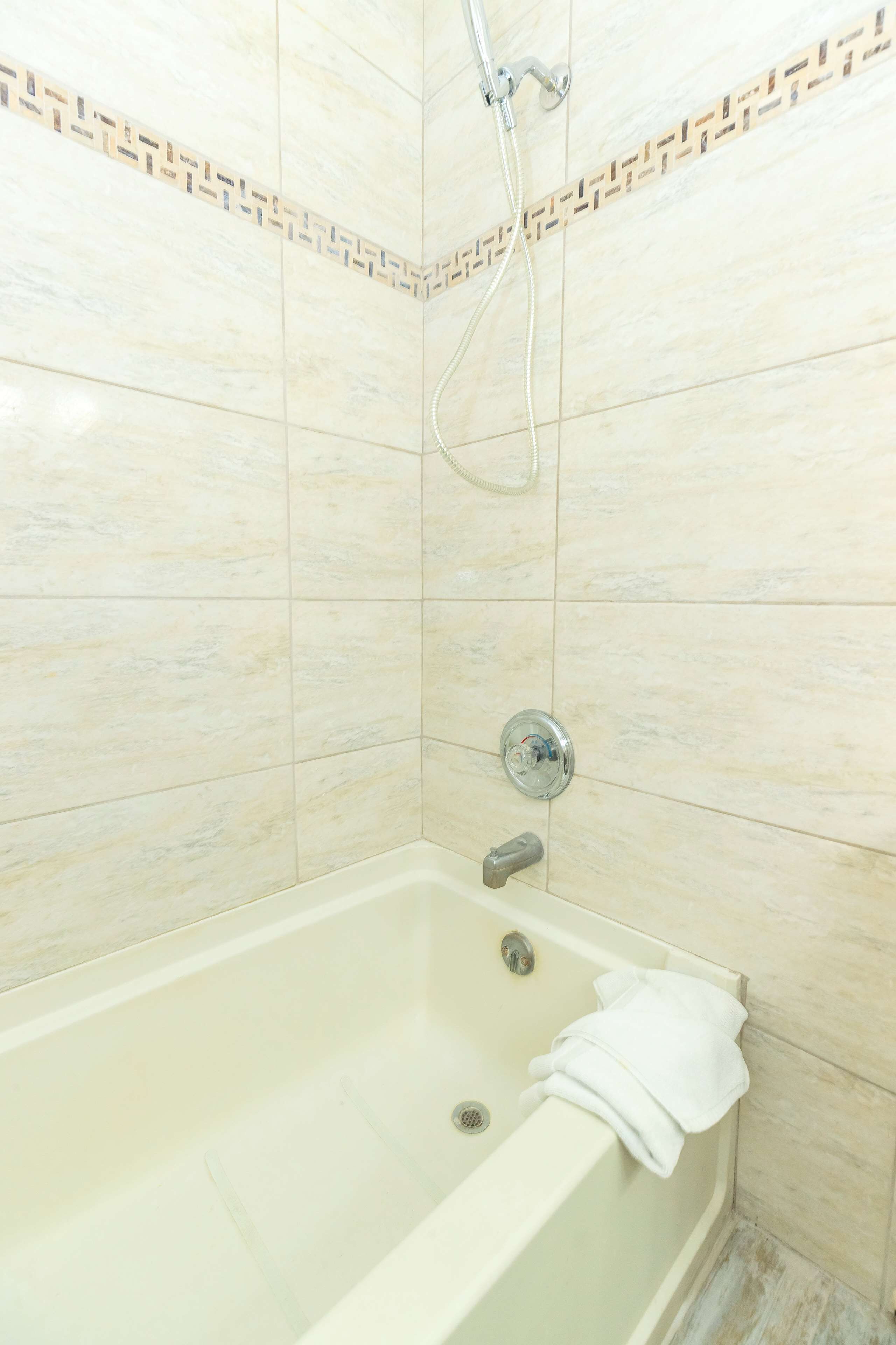 combined shower/bathtub, free toiletries, hair dryer, towels