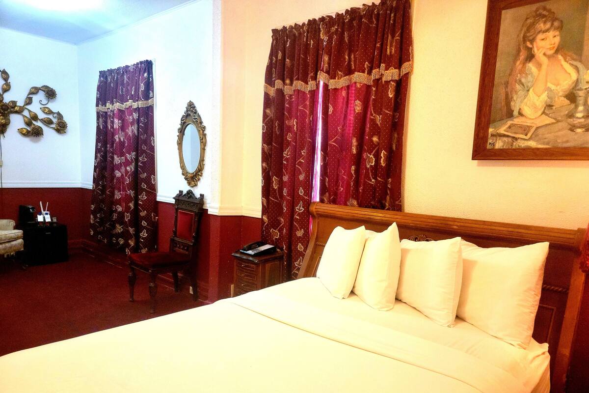 1 Queen Bed Special | Desk, iron/ironing board (on request), cribs (free)
