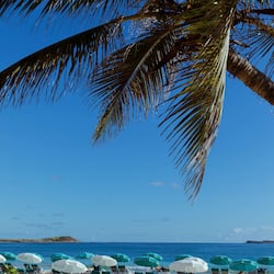 On the beach, white sand, sun-loungers, beach umbrellas