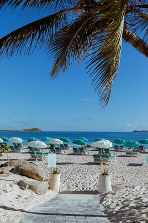 On the beach, white sand, sun-loungers, beach umbrellas - La Playa Orient Bay (Orient Bay)