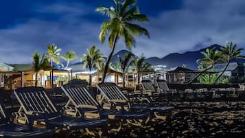On the beach, white sand, sun-loungers, beach umbrellas