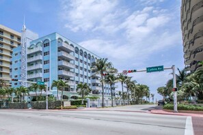 A multi-story hotel with balconies, located at an intersection with Collins Ave. - Solara Surfside (Surfside)