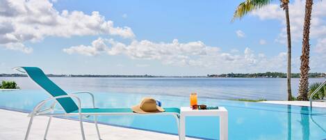 2 outdoor pools, open 8:00 AM to 7:00 PM, pool umbrellas, pool loungers