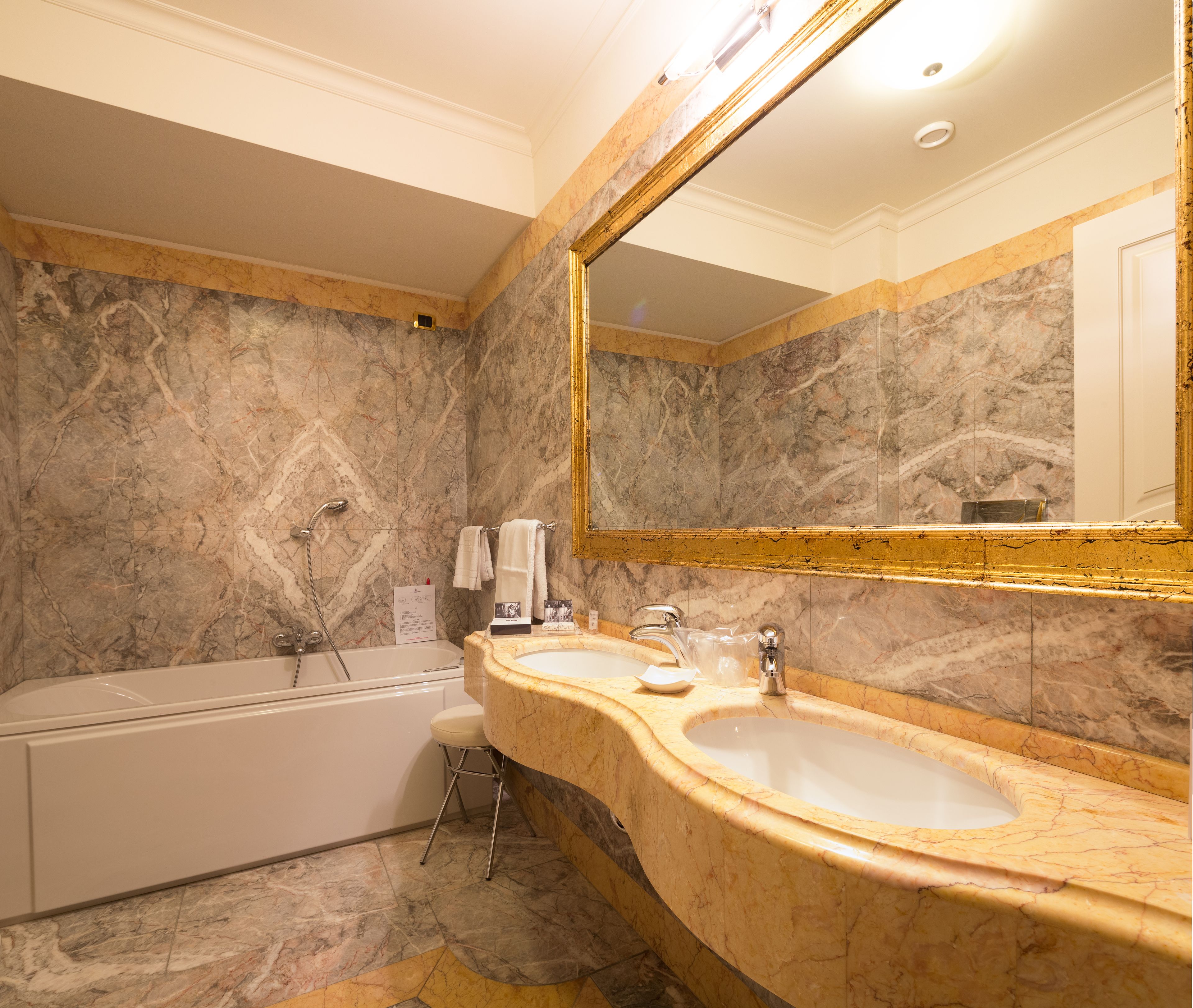 executive suite | bathroom | eco-friendly toiletries, hair dryer, bathrobes, towels