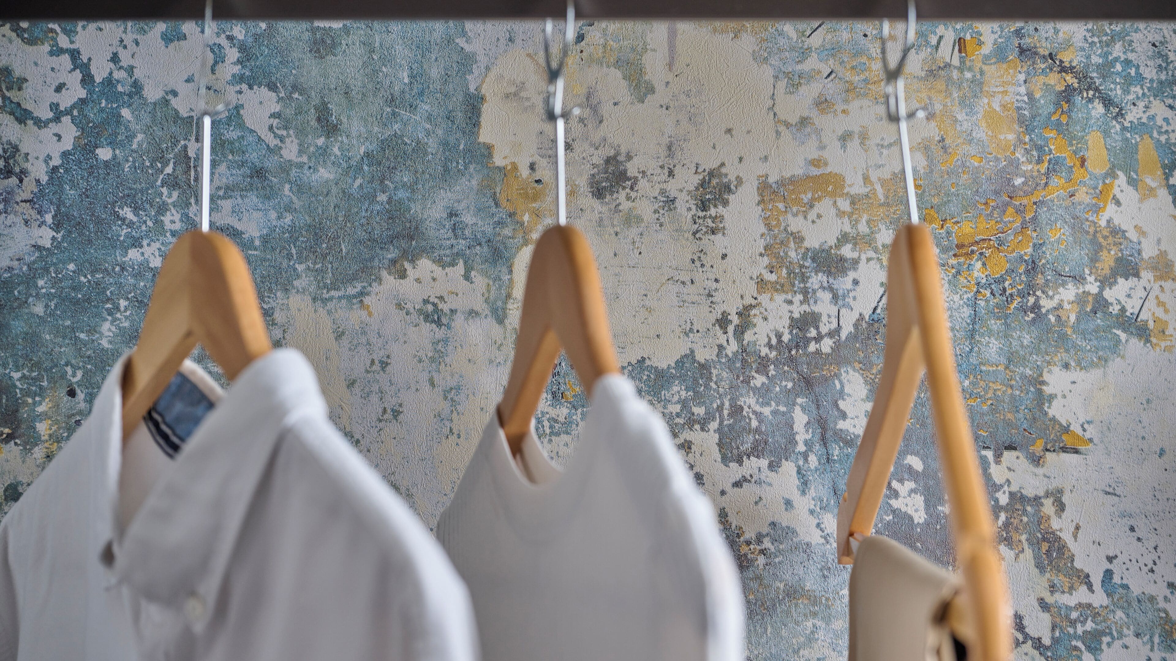 A wall with a distressed, textured surface.