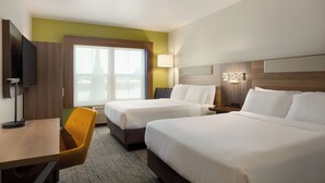 A hotel room with two beds, a desk, a chair, a TV, and a window with blinds. - Holiday Inn Express West Sacramento by IHG (West Sacramento)