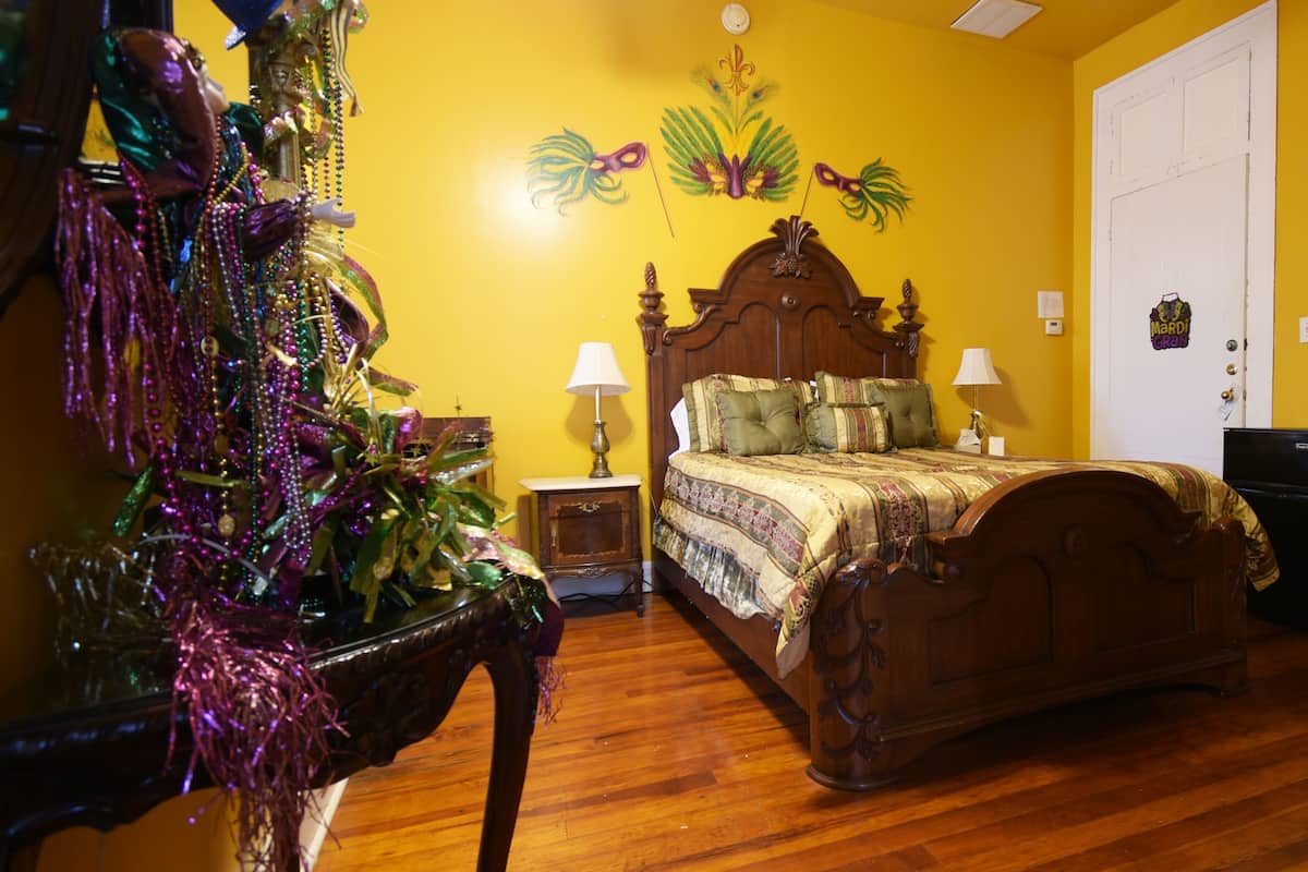 Mardi Gras Room | Premium bedding, individually decorated, individually furnished