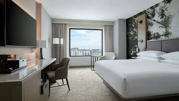 Premium bedding, desk, laptop workspace, blackout curtains