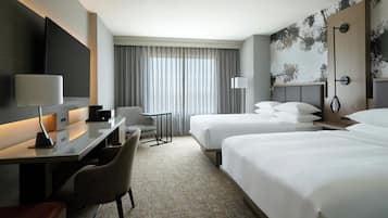 Premium bedding, desk, laptop workspace, blackout curtains