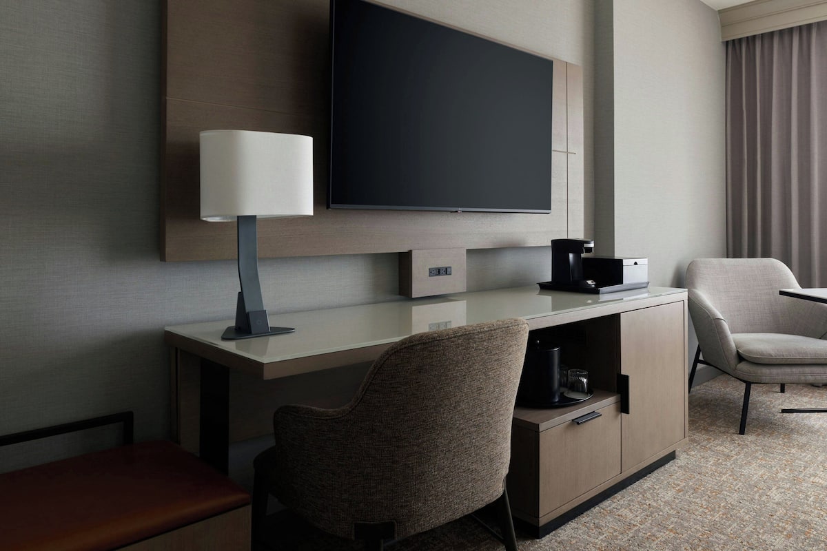 Premium bedding, desk, laptop workspace, blackout curtains