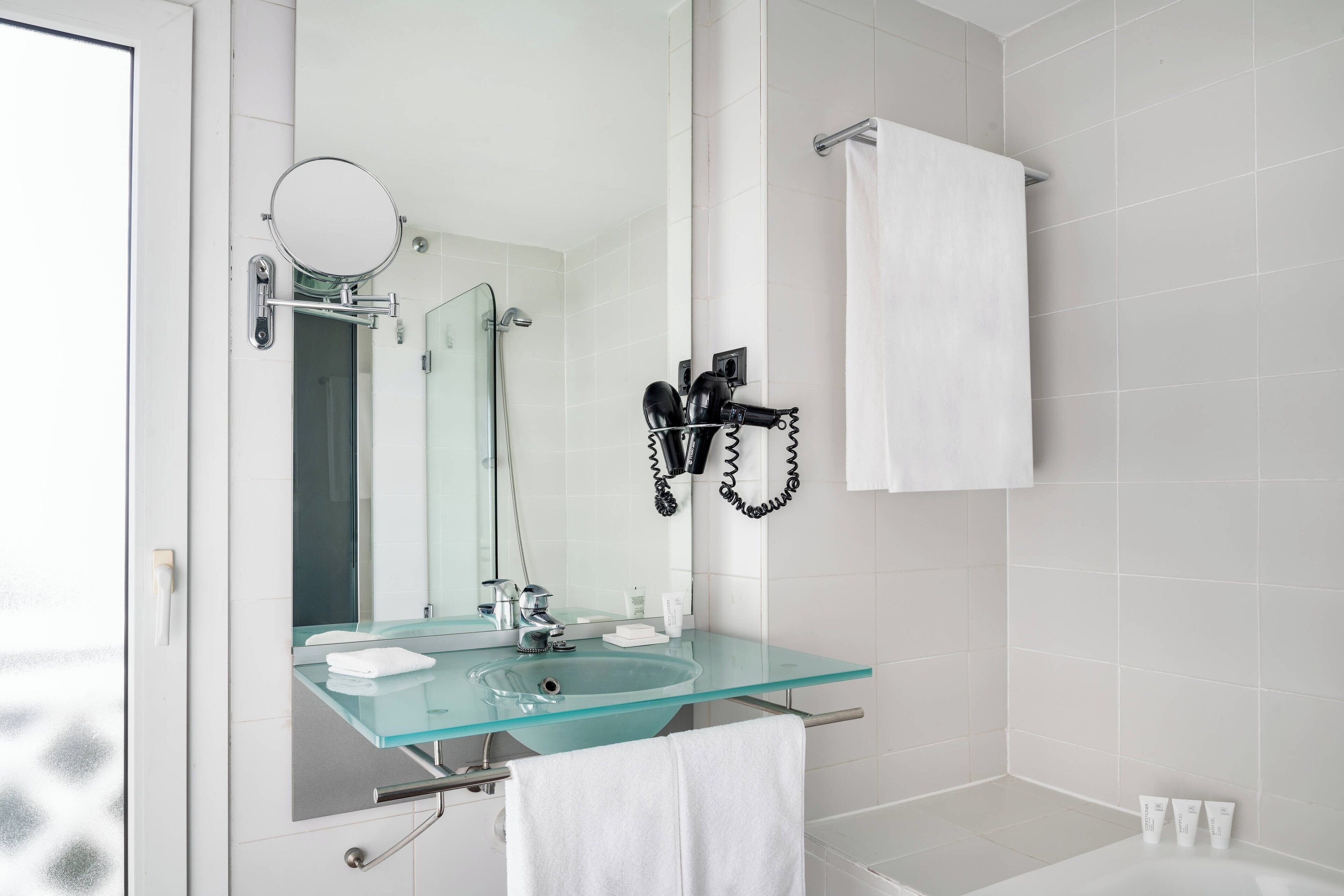 separate bathtub and shower, designer toiletries, hair dryer, towels