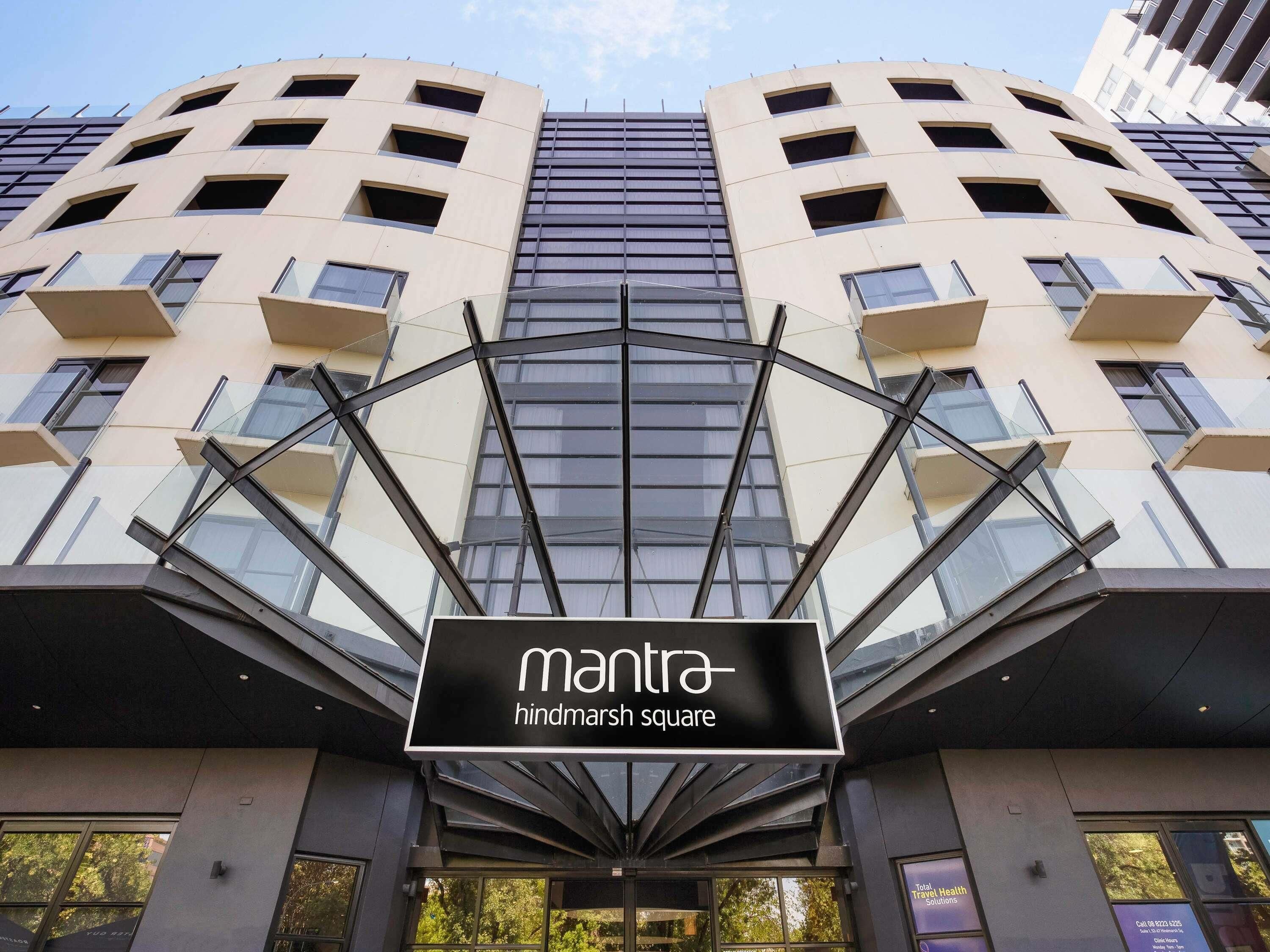 A modern building with a sign reading 'mantra hindmarsh square.'