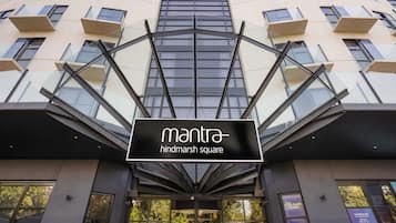 A modern building with a sign reading 'mantra hindmarsh square.'