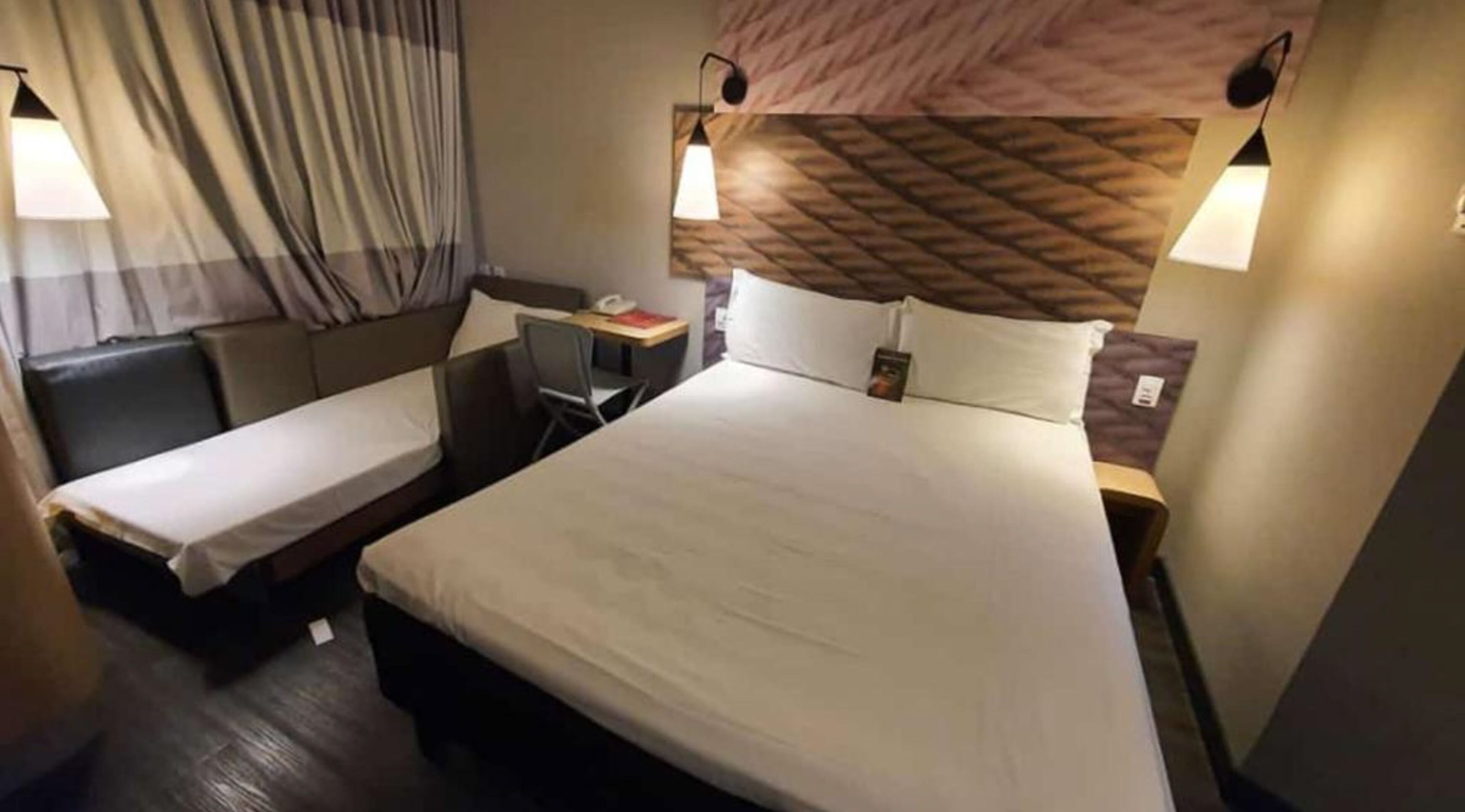 room, multiple beds | living room | tv