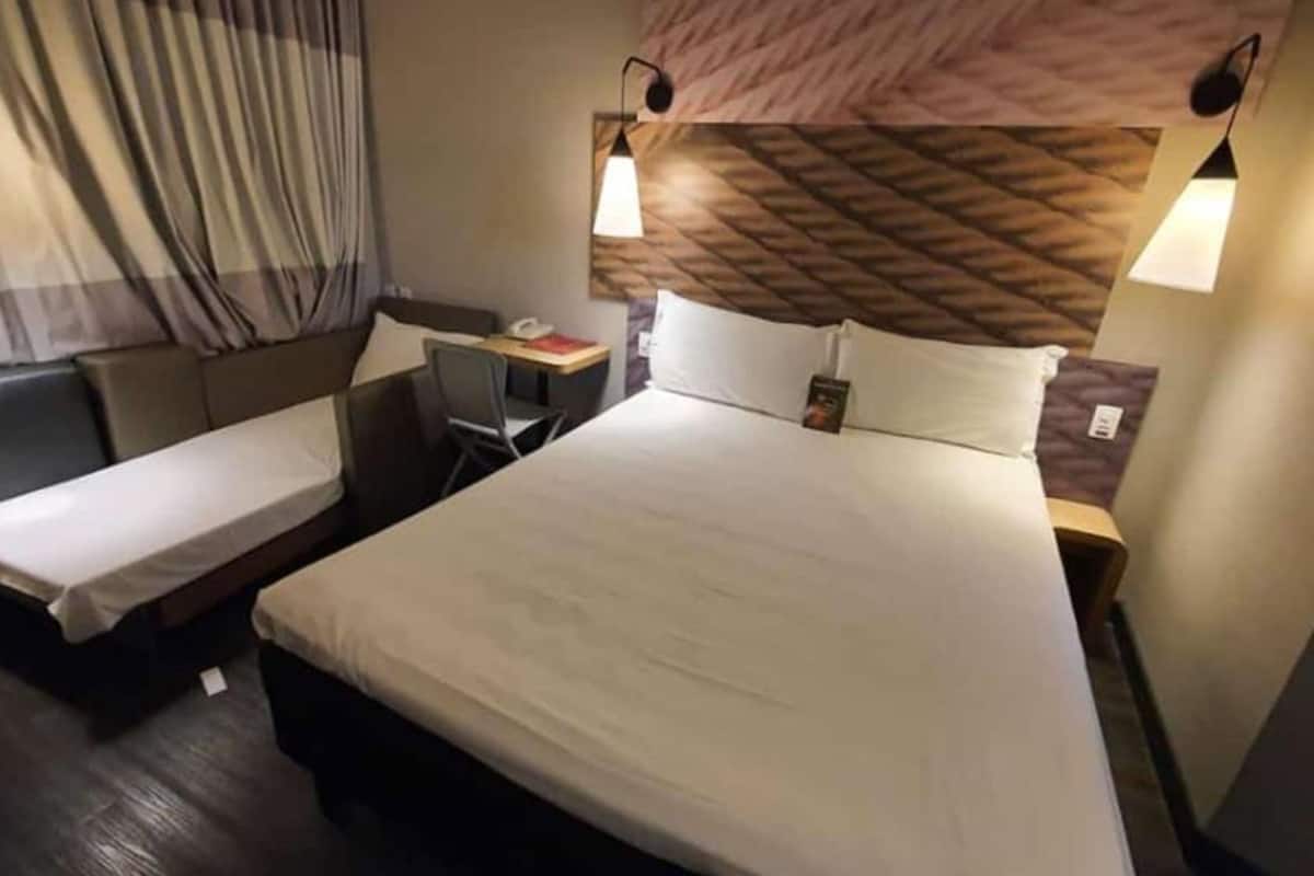 room, multiple beds | living room | tv