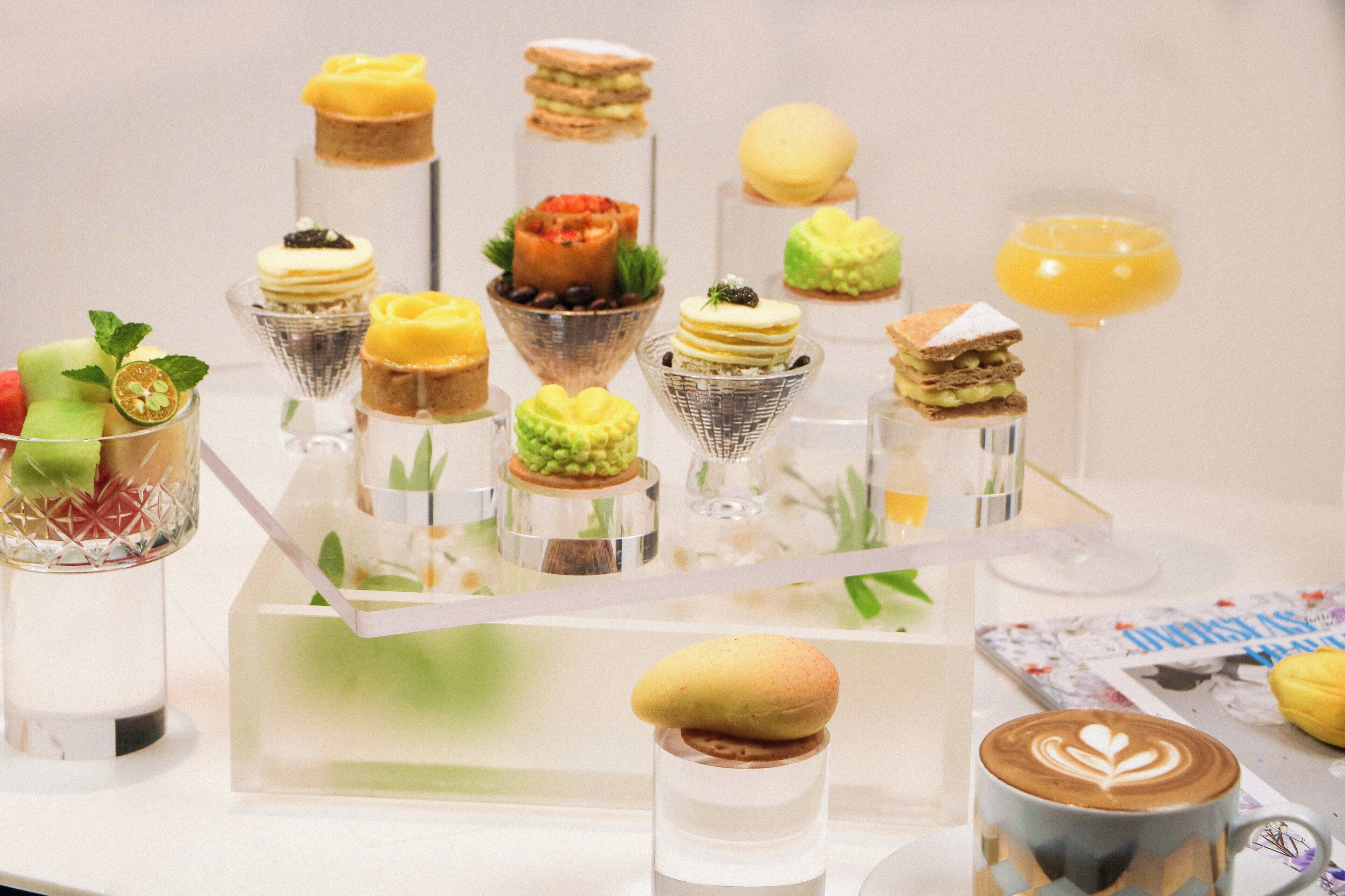A variety of desserts and beverages displayed on a table.
