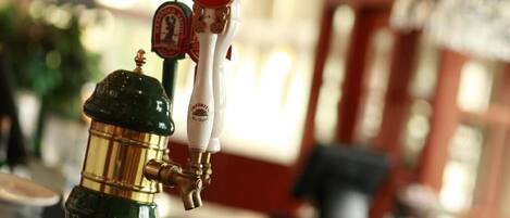 A bar with a tap labeled "STELLA ARTOIS" and another tap with a red label.