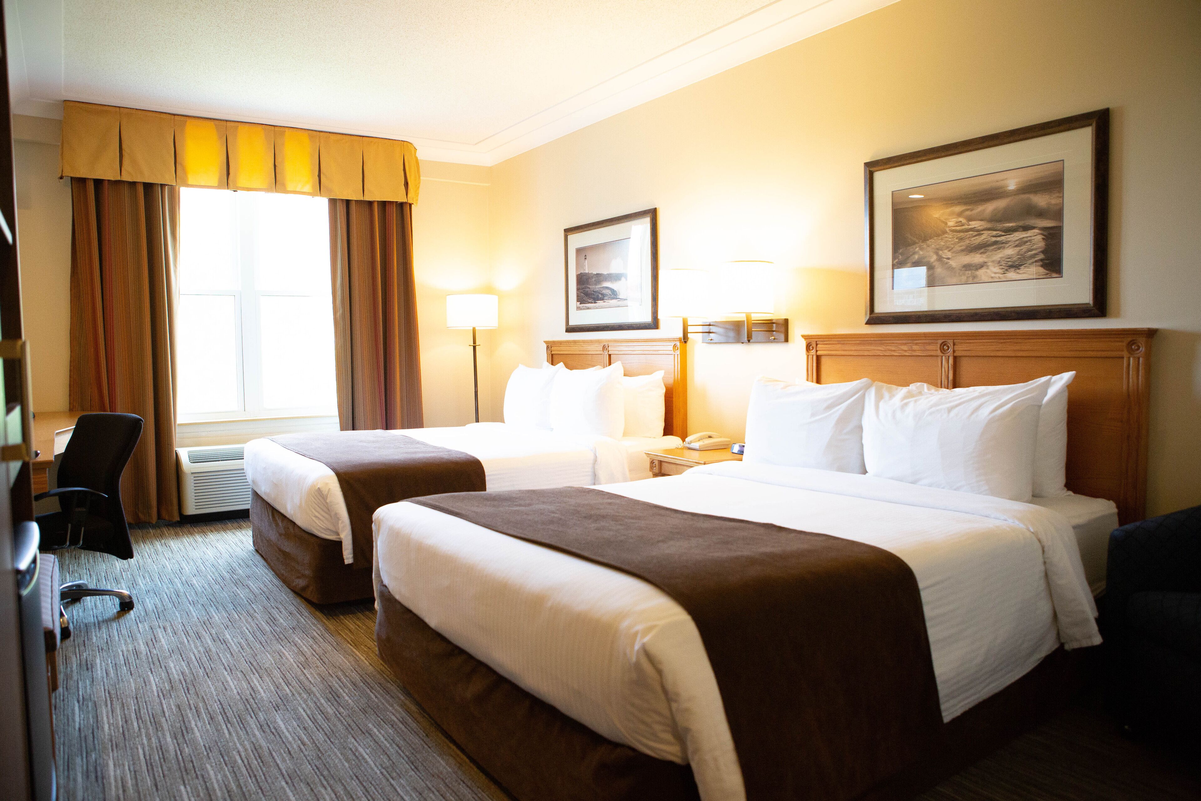 premium bedding, pillow-top beds, desk, blackout curtains