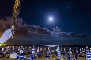 Private beach, black sand, sun-loungers, beach umbrellas