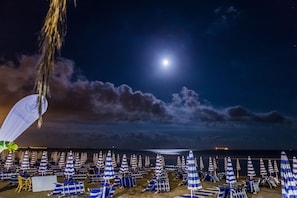 Private beach, black sand, sun-loungers, beach umbrellas