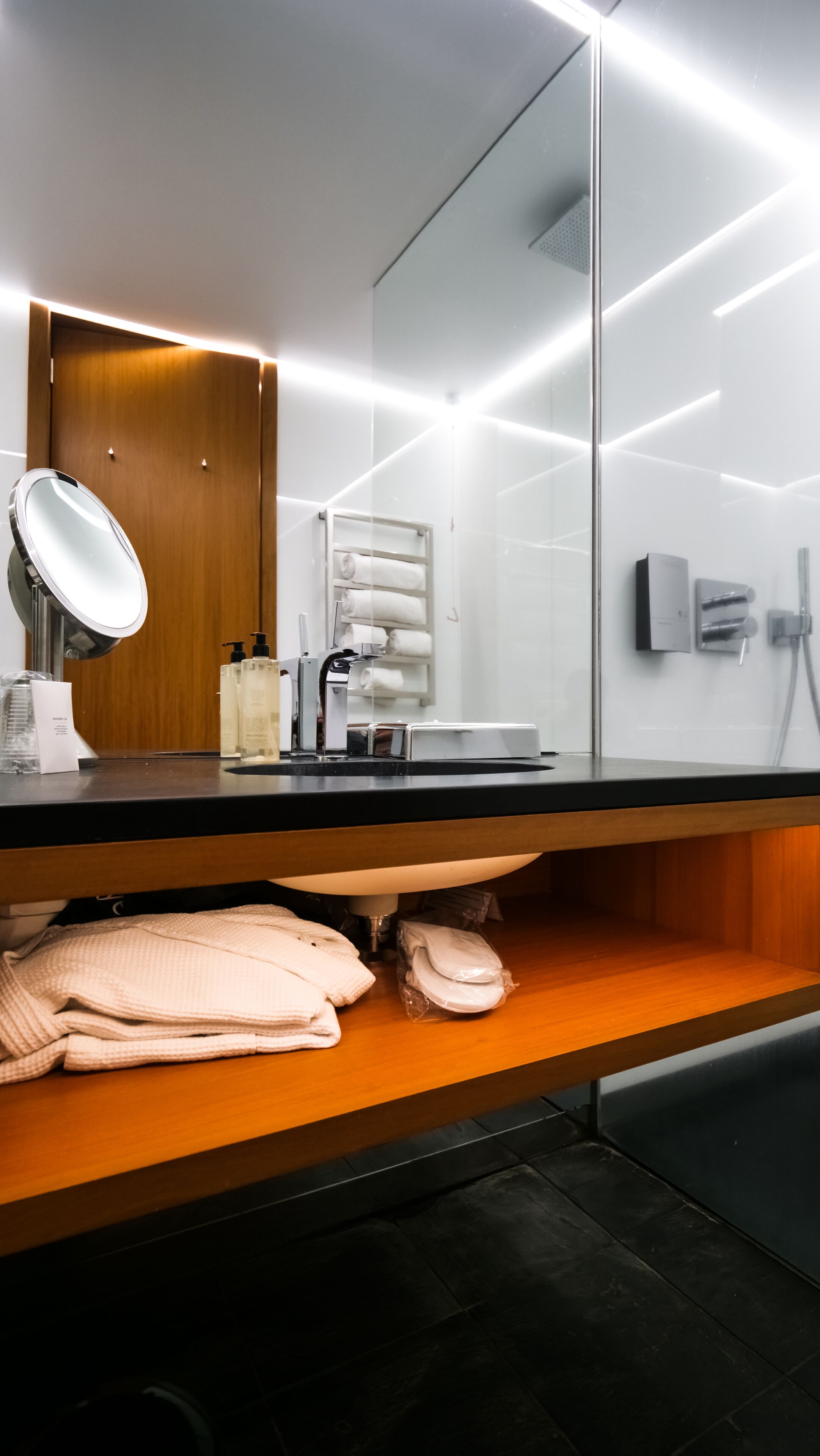 hair dryer, bathrobes, slippers, towels