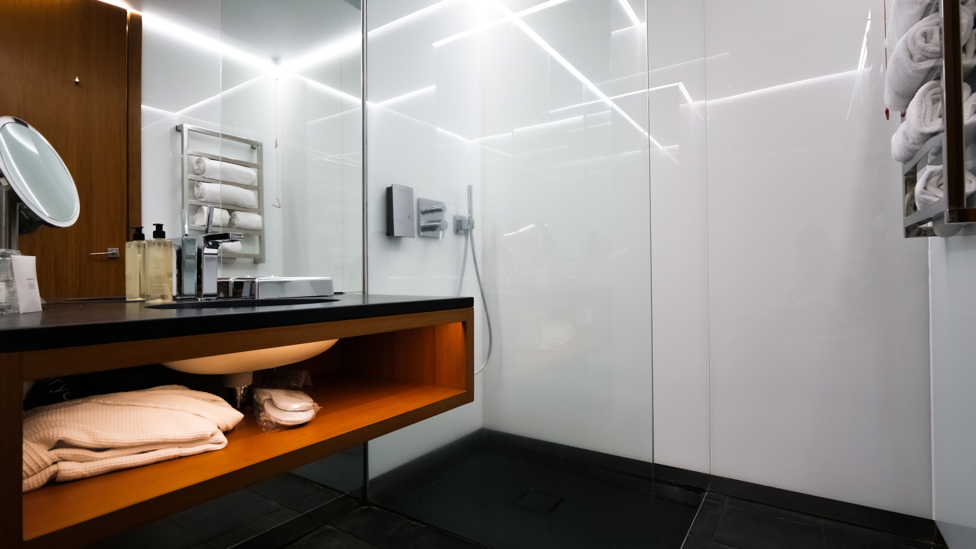 hair dryer, bathrobes, slippers, towels