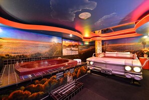 1 King Bed, Non Smoking, Jetted Tub Suite (Jungle, Cave, or 50s Theme) | Individually decorated, blackout drapes, soundproofing