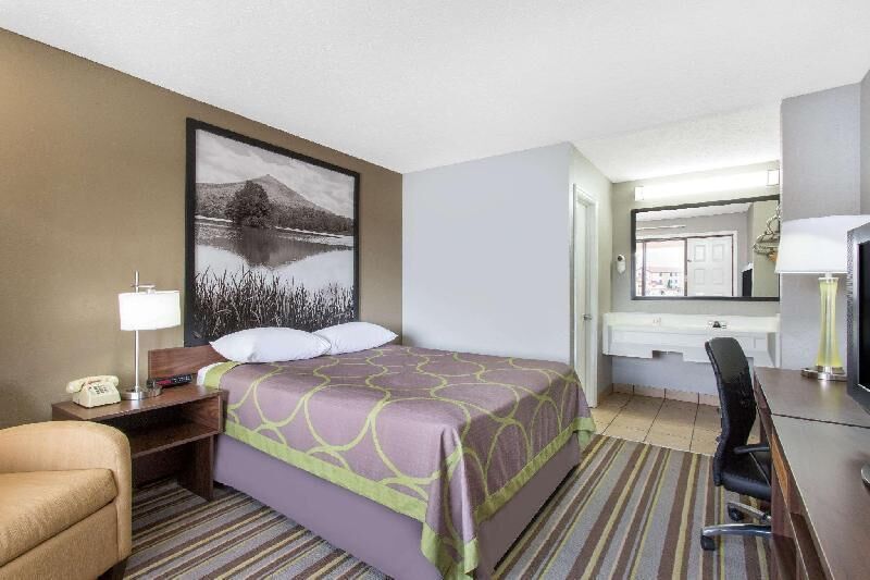 Desk, laptop workspace, blackout curtains, iron/ironing board